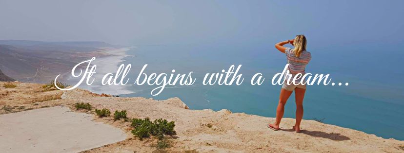 girl standing on the cliff and overlooking the ocean
